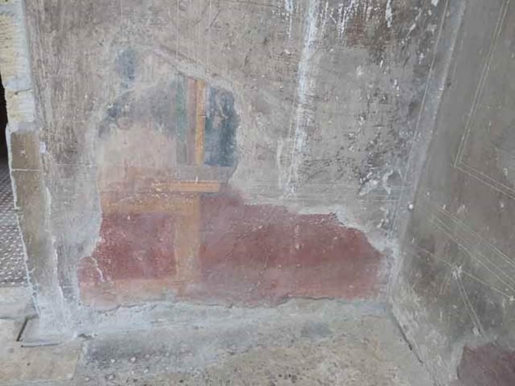 V.1 Herculaneum. May 2010. West wall of atrium, detail of painted zoccolo in north-west corner.
